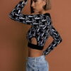 Černý top ARNALDO s průstřihy Velikost: M/L - Image 3